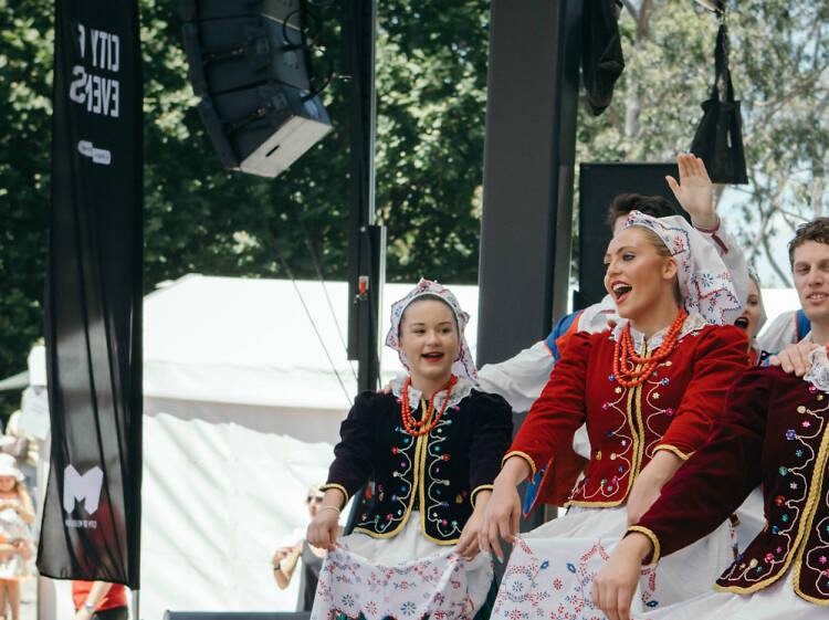 Dancers dressed in traditional Polish costume
