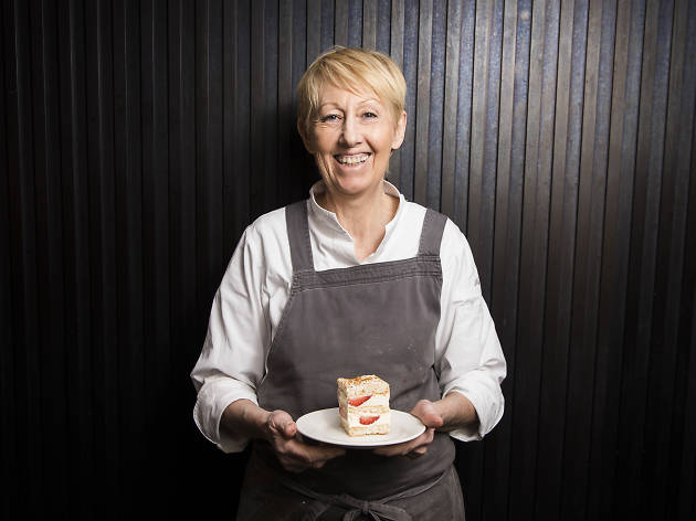 Lorraine Godsmark Lorraine Godsmark holding a cake outside Lorraine's Patisserie