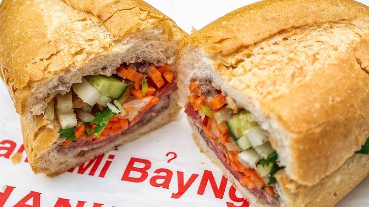 A banh mi sandwich sliced in half at Banh Mi Bay Ngo