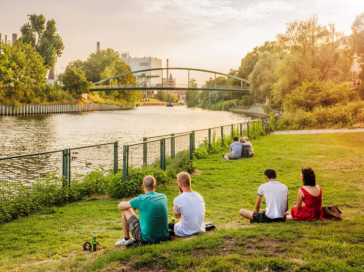 Picnickers by the river in Wedding in Berlin