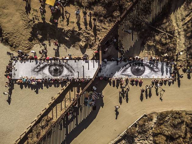 JR, Migrants, Mayra, Picnic across the border, Tecate, Mexico–U.S.A., 2017 JR, Migrants, Mayra, Picnic across the border, Tecate, Mexico–U.S.A., 2017