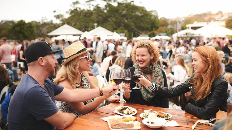 People holding red wine glasses at Hunter Valley Uncorked Balmoral.