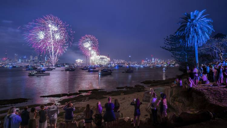 People watching the fireworks at Shark Island on NYE. 