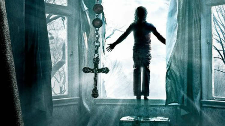 Creepy photo feature a child near an open window and a crucifix