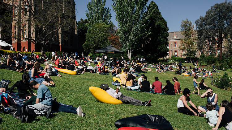 People lounging on the Abbotsford Convent lawns