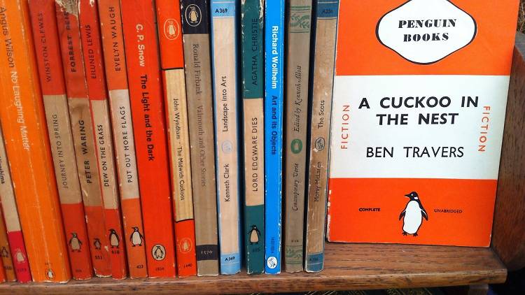 Stack of Penguin books on a shelf