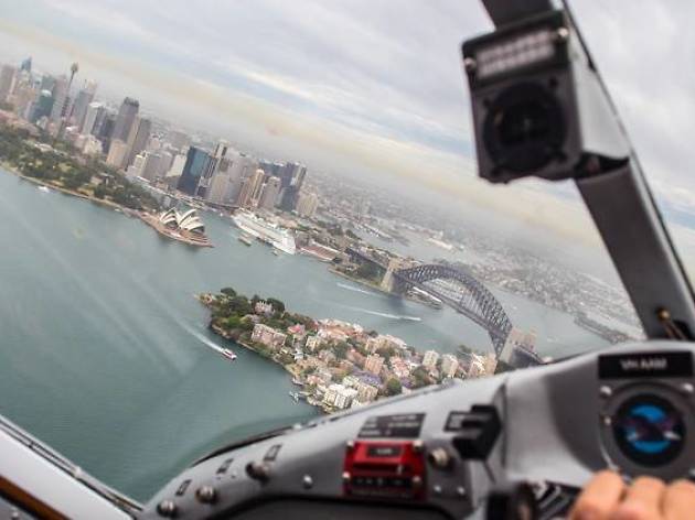 Sydney Seaplanes A pilot flys over Sydney Harbour