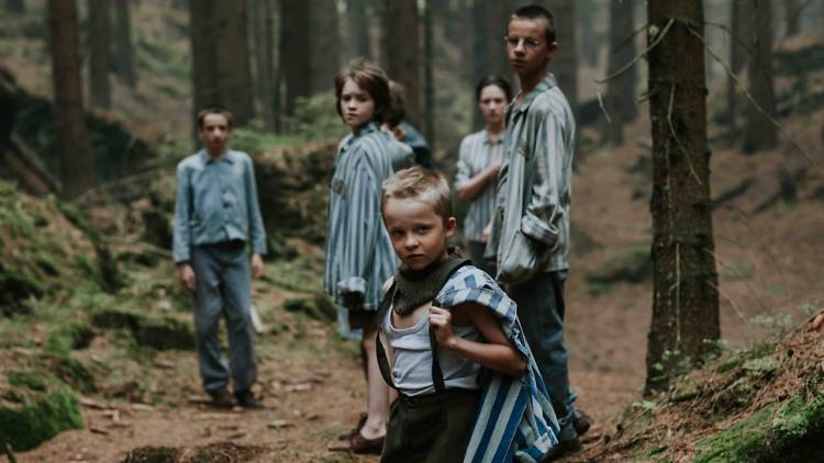 Escaped child concentration camp inmates in a forest