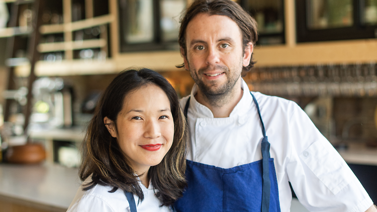 Two chefs posing for a photo