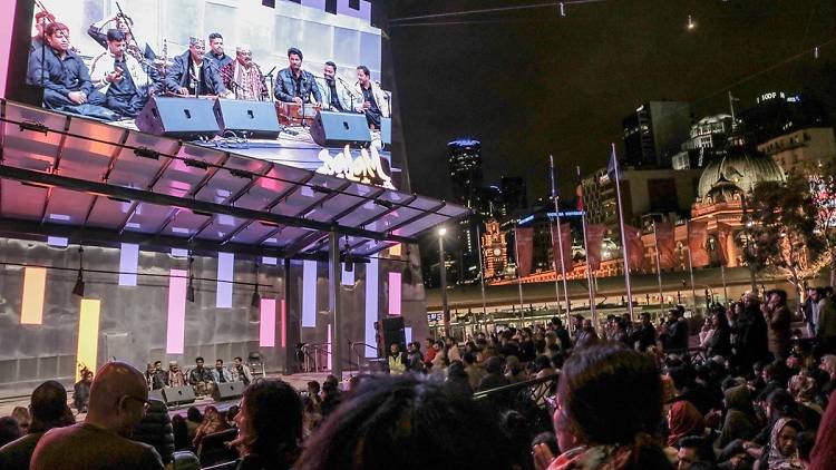 Crowd watching screen at Federation Square