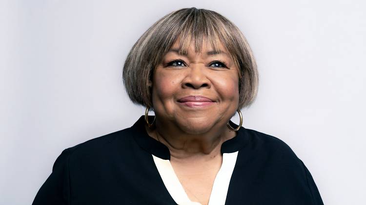 Portrait of Mavis Staples, smiling and looking to distance