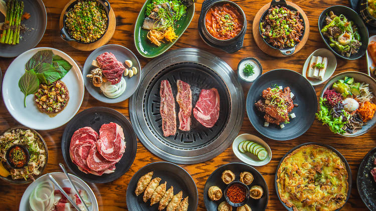 A variety of dishes and meats on a table