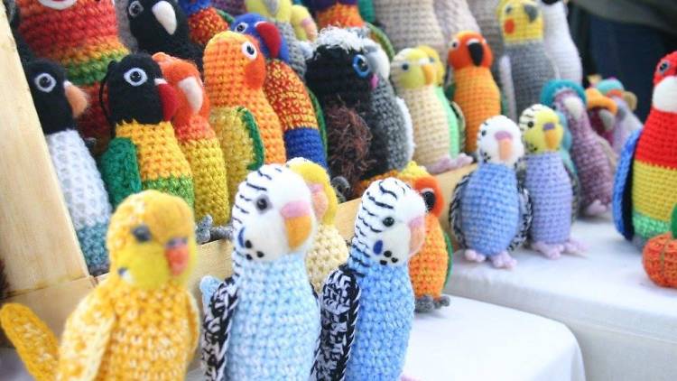 A group of knitted Australian bird toys