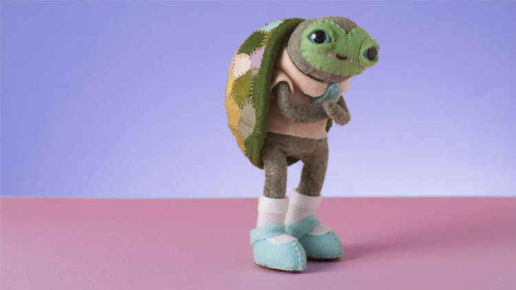 A scheming turtle felt toy