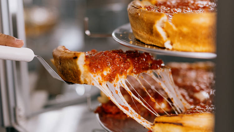 Eat deep dish pizza in the city where it was created