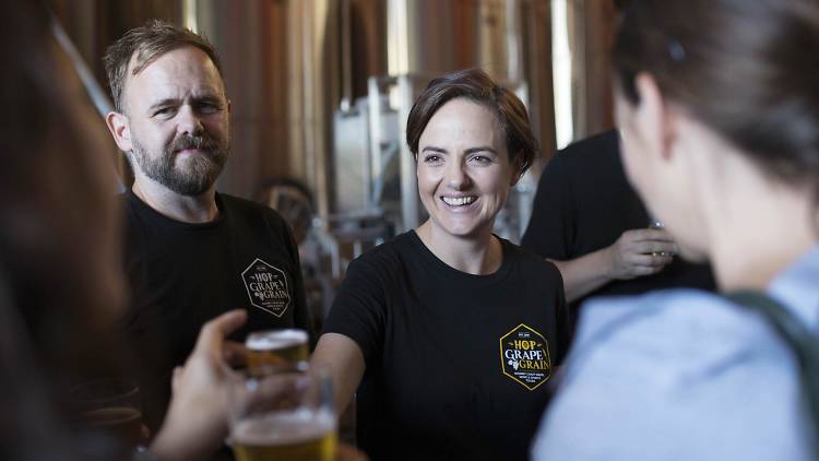 People drinking beer at a brewery.