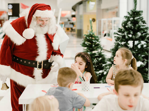 Christmas Springvale Homemaker Centre Santa saying hello to kids crafting