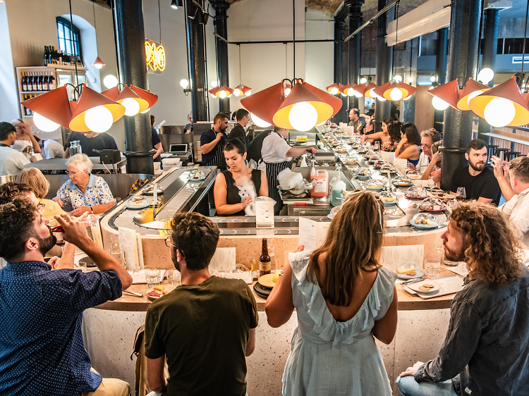 Eat cheese from a conveyor belt