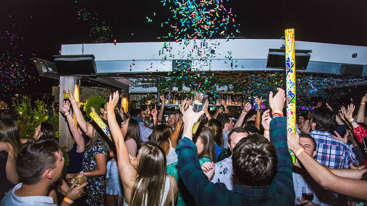 people partying at night with confetti