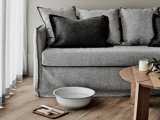 Mitchelton Day Spa A large bowl and pedicure supplied sit infront of a grey couch.