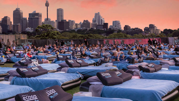 Sydney skyline in the background of an outdoor cinema