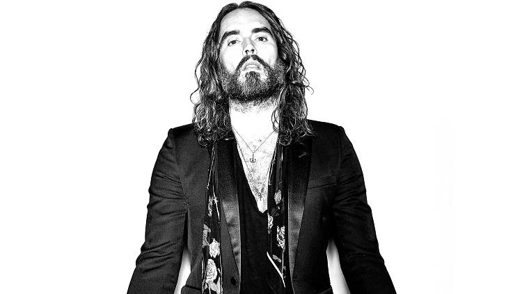 Russell Brand in black-and-white posing for his new show, Recovery Live.