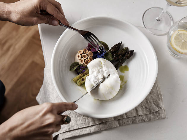 Mullane's Hotel A plate of burrata and asparagus shot from overhead at Sarino's