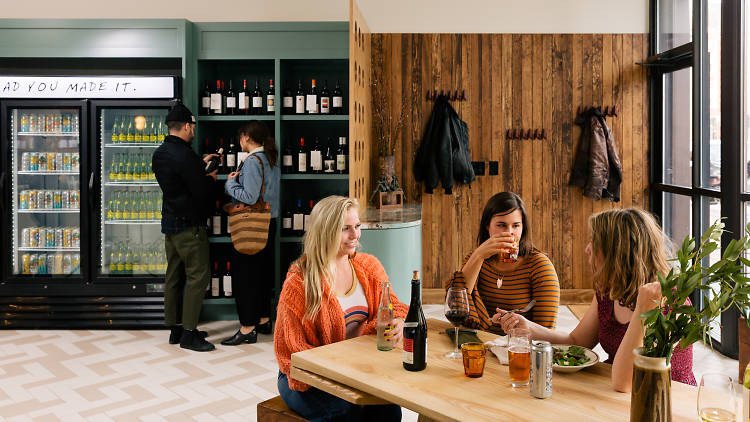 People hanging out at a wine bar