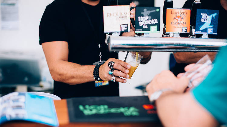 Bartender serving beer at festival