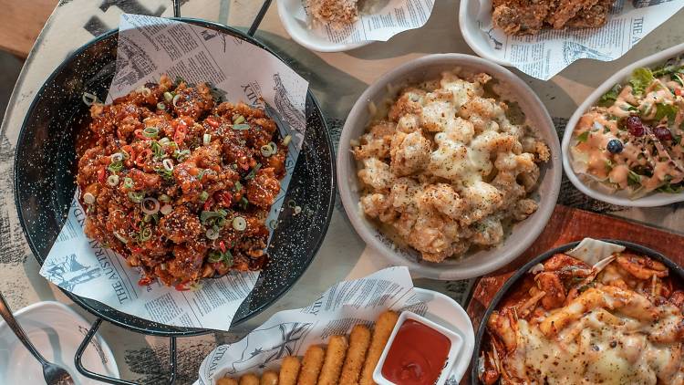 Flat lay of fried chicken and other dishes at Chicken V