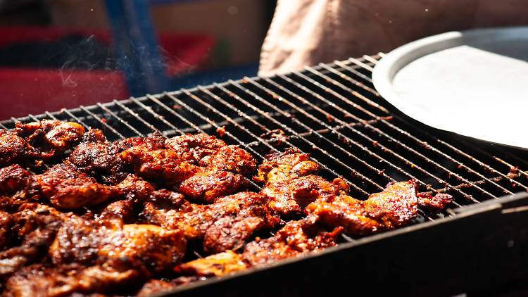 Meat being grilled on a BBQ