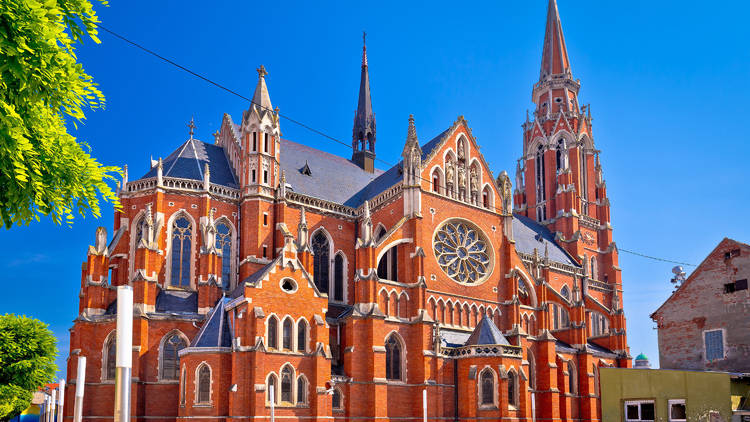 Osijek's shrub-lined Church of St. Peter and St. Paul