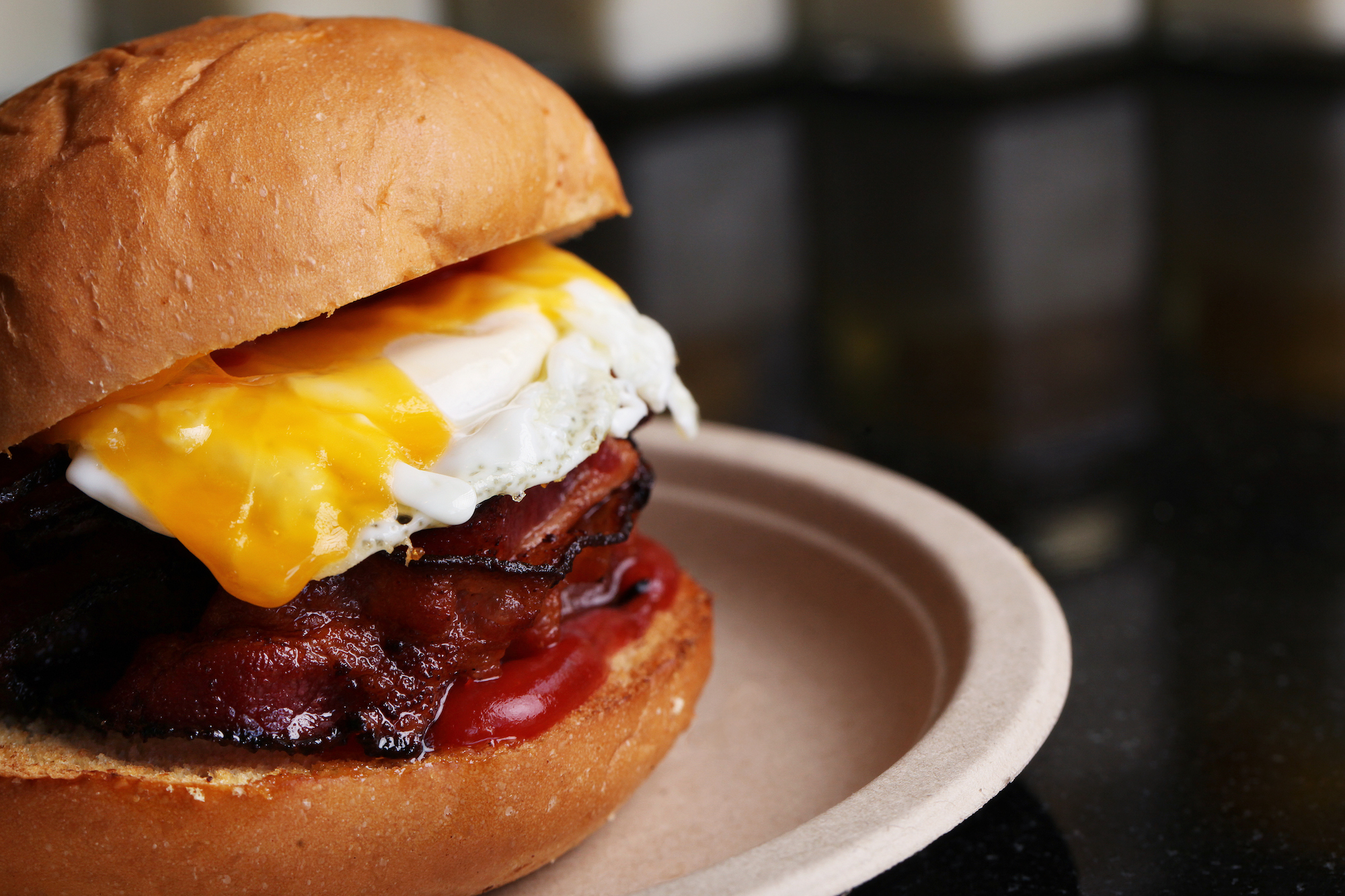 Eggslut brioche with fried egg and bacon