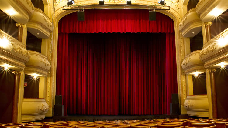 empty theatre; red curtain