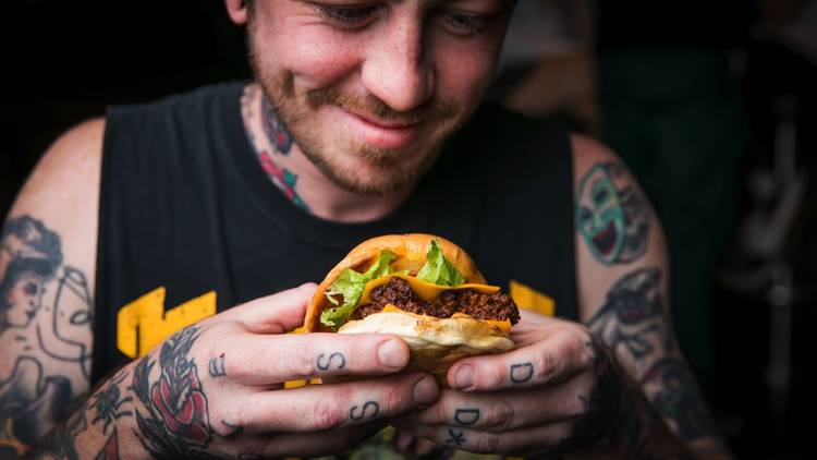 Person holding a burger at Mary's Circular Quay