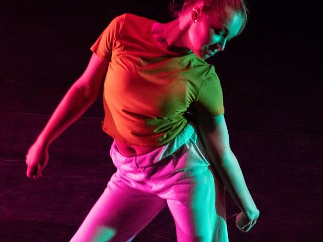 woman dancing a woman in a tshirt and track pants dances