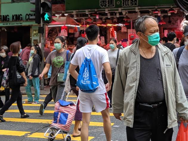 syp covid old man wearing mask pedestrians crossing the road in Sai Ying Pun