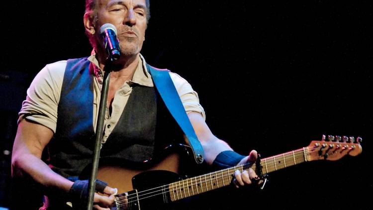 Bruce Springsteen performing on stage