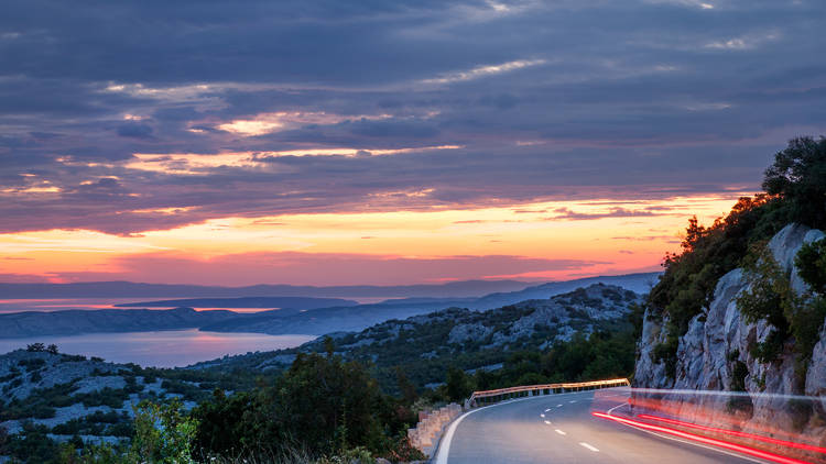 Traveling in sunset on the mountain road, Dalmatian coast 