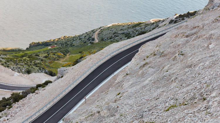 A new road on a mountain slope on the coast