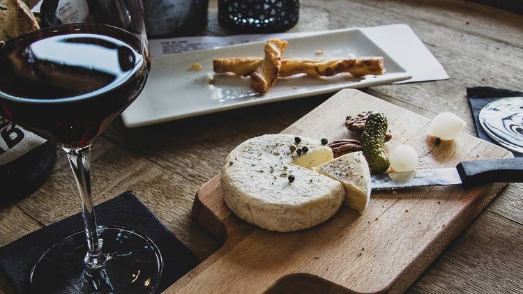 Cheese board and glass of red wine