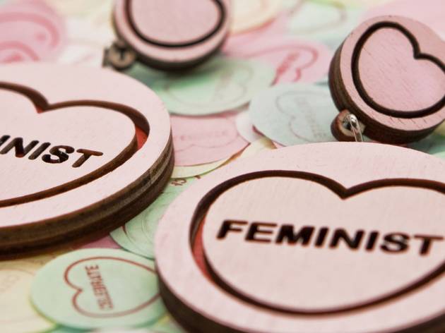QVWC Shop Round earrings with love hearts and 'feminist' laser cut into them