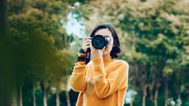 Girl holding camera