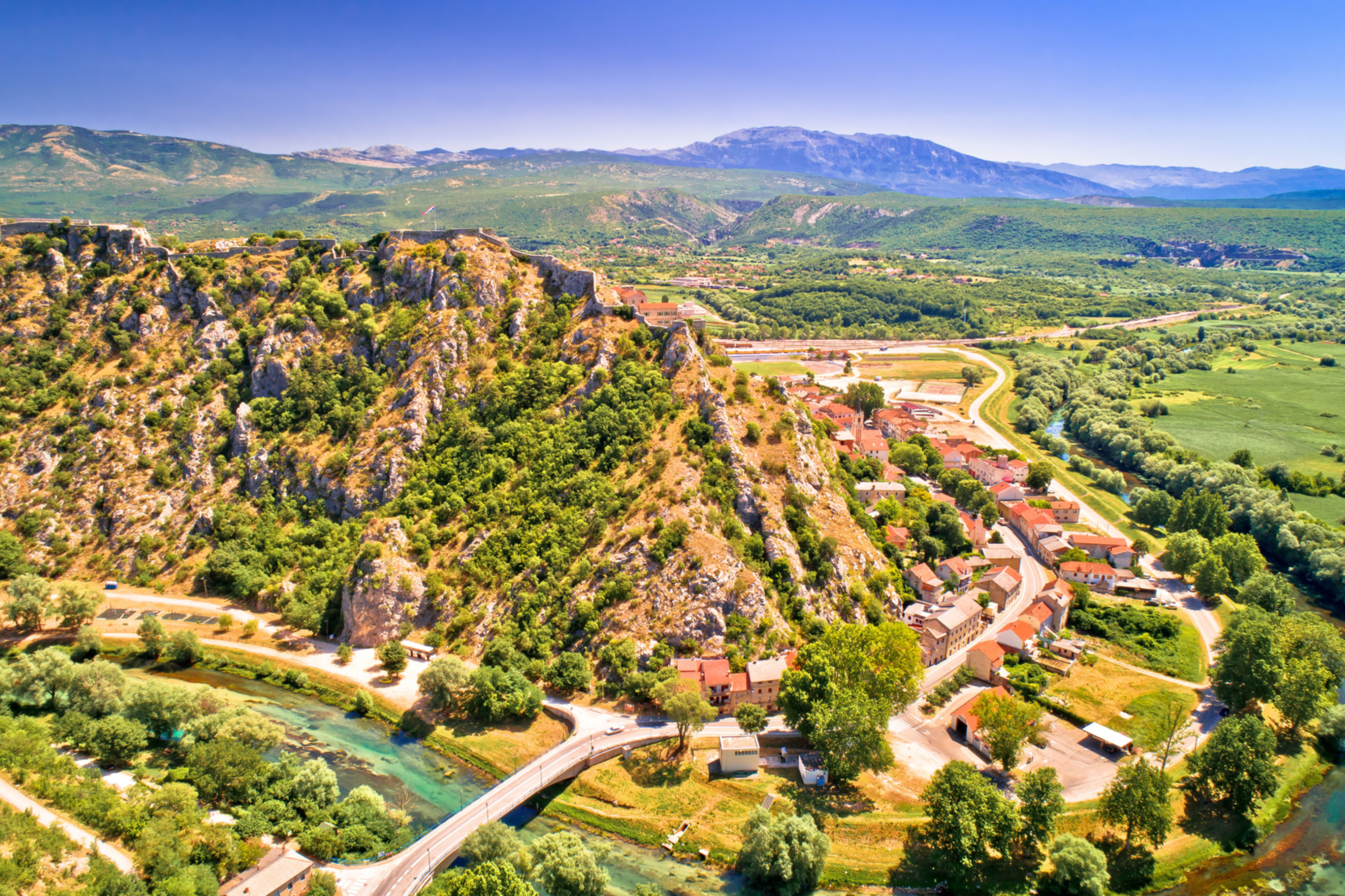 Knin town, fortress and Krka river aerial view, second largest fortress in Croatia