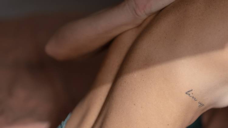 an abstracted torso contorts in a yoga pose
