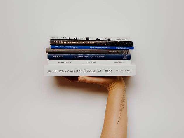 Person holding books Person holding books