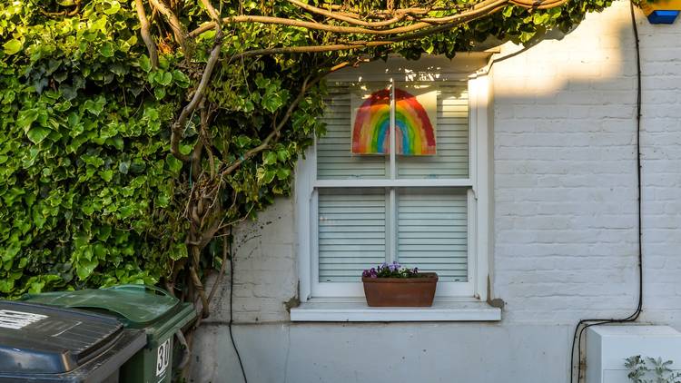 london house with NHS rainbow poster