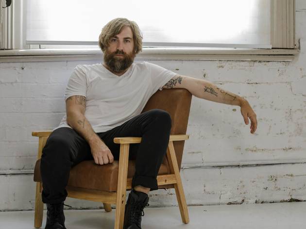 Josh Pyke for Time In Sessions Josh Pyke sits in a chair in an edgy warehouse