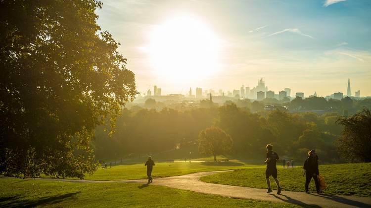 Runners on Primrose Hill during a London heatwave