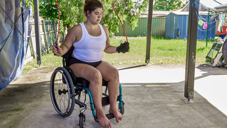 Woman exercising in wheelchair wearing Modibodi undies